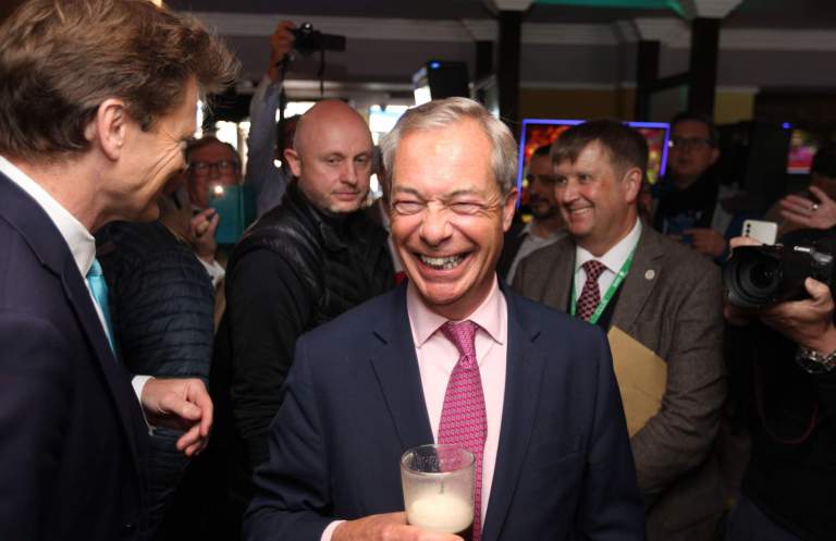 Reform UK leader Nigel Farage and chairman, Richard Tice, enjoy a beer during a launch event at Clacton-on-Sea on June 4. Photo: ZUMA Press, Inc. / Alamy