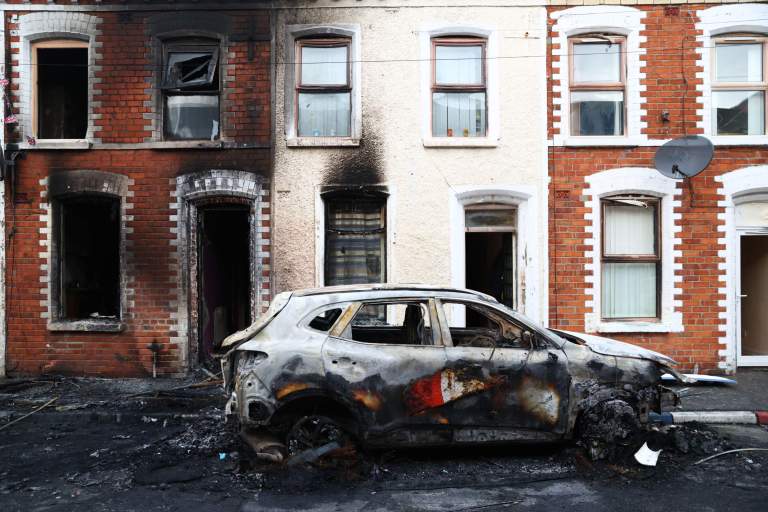 A view of the damage after rioting broke out late Tuesday, in east Belfast, Northern Ireland, Wednesday, June 10, 2026, following a stabbing incident. (AP Photo/Peter Morrison)