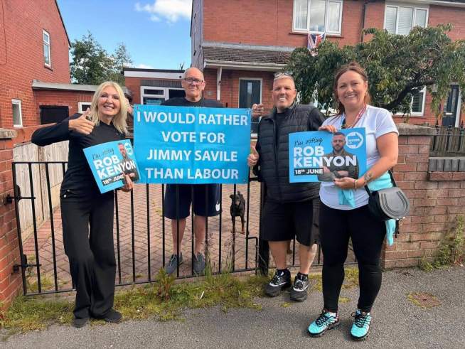 Reform Councillors Pose with Banner Saying They’d ‘Rather Vote for Jimmy Savile than Labour’