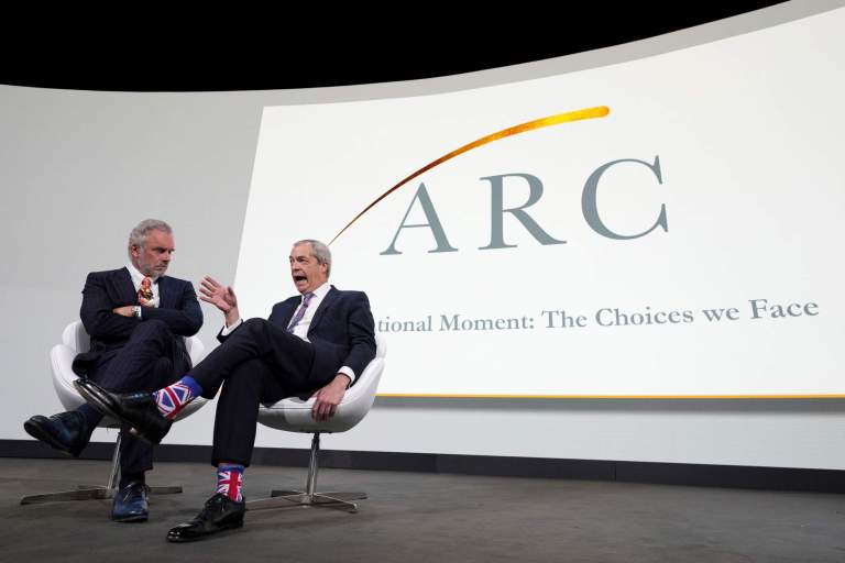 Nigel Farage, Leader of Reform UK, right, as he is interviewed on stage by Jordan Peterson, left, at the ARC (Alliance for Responsible Citizenship) conference in London, Tuesday, Feb. 18, 2025. (AP Photo/Kirsty Wigglesworth)