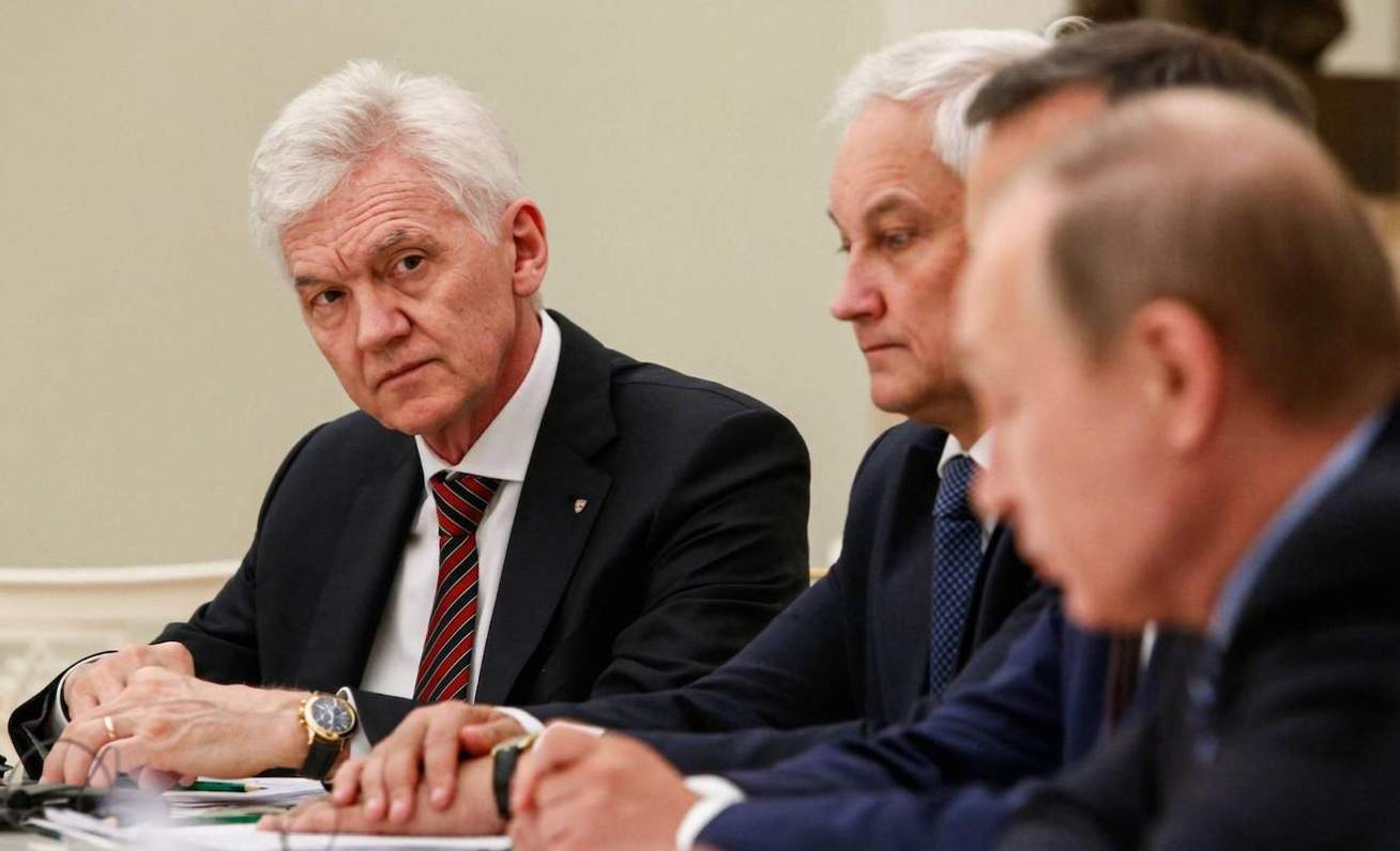 Russian tycoon Gennady Timchenko, left, attends a meeting of Russian President Vladimir Putin, right, with French businessmen in the Kremlin in Moscow, Russia, Wednesday, May 25, 2016. (Sergei Karpukhin/Pool Photo via AP)