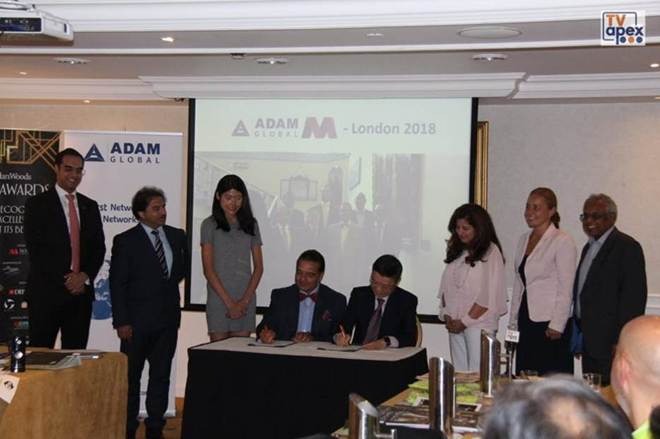 McMillan Woods and Adam Global representatives at the 2018 partnership-signing ceremony in London.