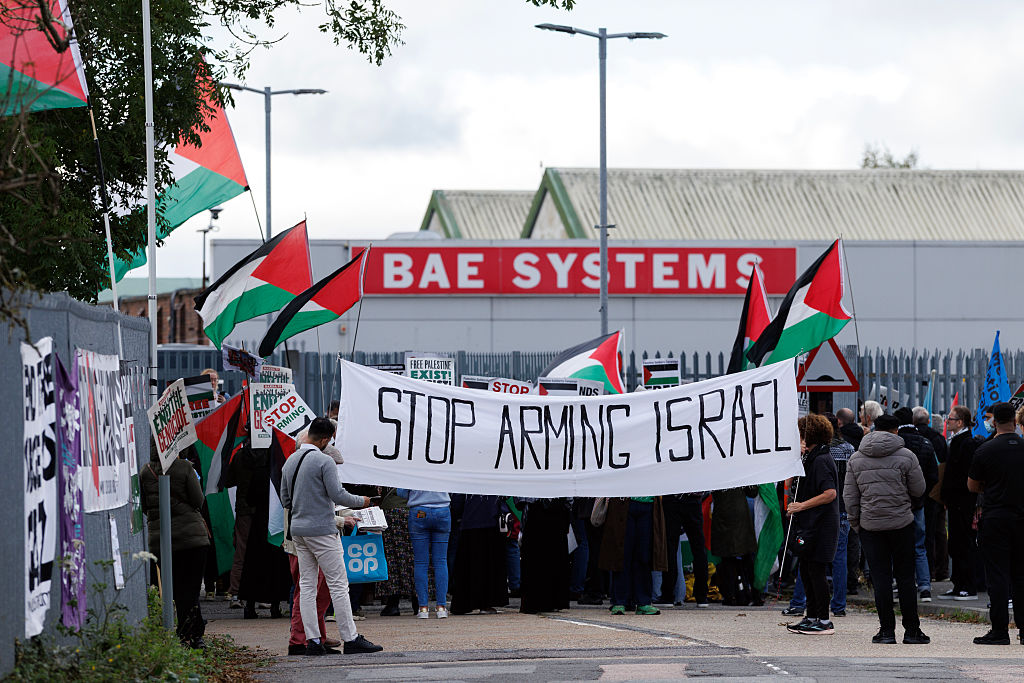 ROCHESTER, ENGLAND - OCTOBER 08: Pro-Palestinian campaigners gather outside a BAE Systems site on October 08, 2025 in Rochester, England. Pro-Palestinian campaigners are staging five simultaneous protests outside UK sites they say are linked to manufacturing components of F-35 fighter jets being used by Israel in its military campaign against Gaza. Last year the government suspended arms export licenses to Israel over concerns British-made weapons could be used by the Israeli military in Gaza, in breech of international humanitarian law. On Thursday, the Court of Appeal will hear a legal challenge brought by Al-Haq, a Palestinian NGO arguing that it is illegal for the UK to continue licensing F-35 parts into the global supply chain, under a multilateral defence collaboration, which Israel can continue to access. (Photo by Dan Kitwood/Getty Images)