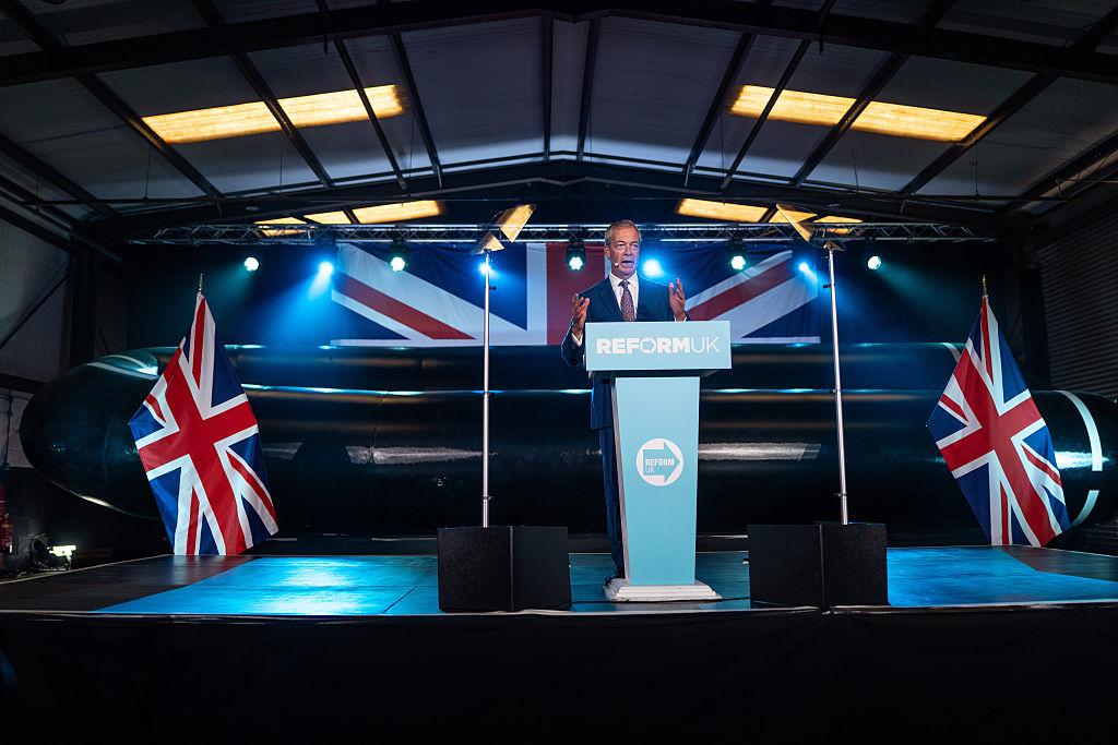 HYTHE, ENGLAND - OCTOBER 12: Reform UK leader, Nigel Farage, speaks at a press conference on October 12, 2026 in Hythe, England. Reform UK are proposing a five year ban on migrants being granted asylum, and to shut down Britain's asylum system for a full parliamentary term if elected. (Photo by Carl Court/Getty Images)