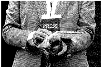 on the ground column image - a (male) journalist with press pass and notepad